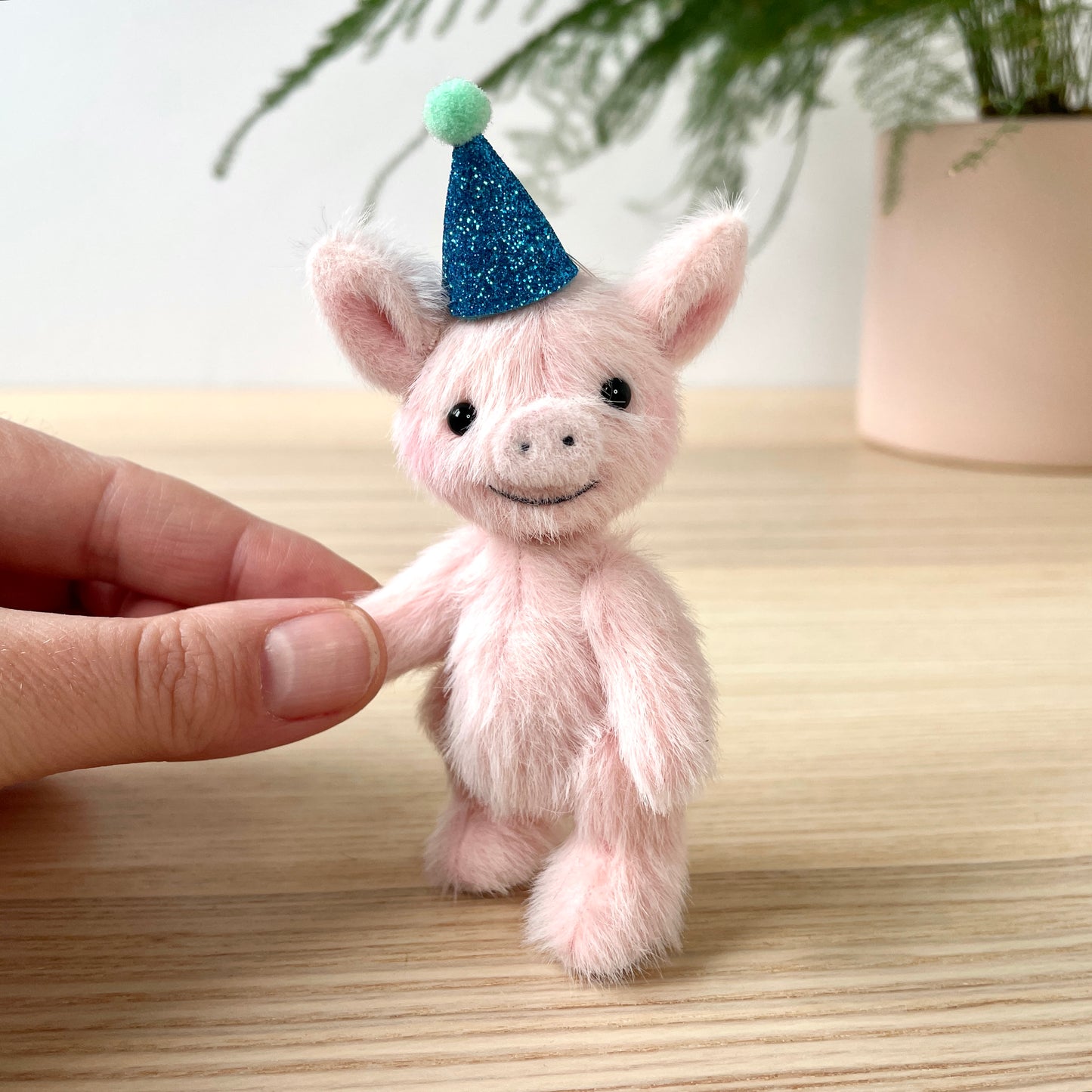 Party piglet with a blue party hat