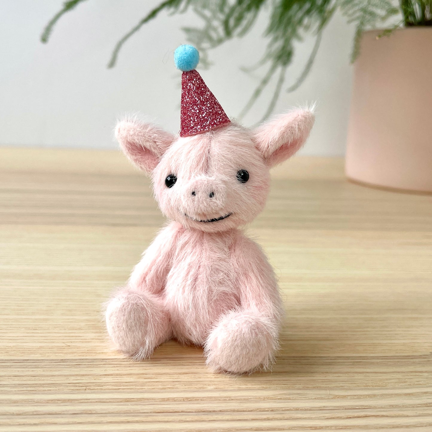 Party piglet with a pink party hat