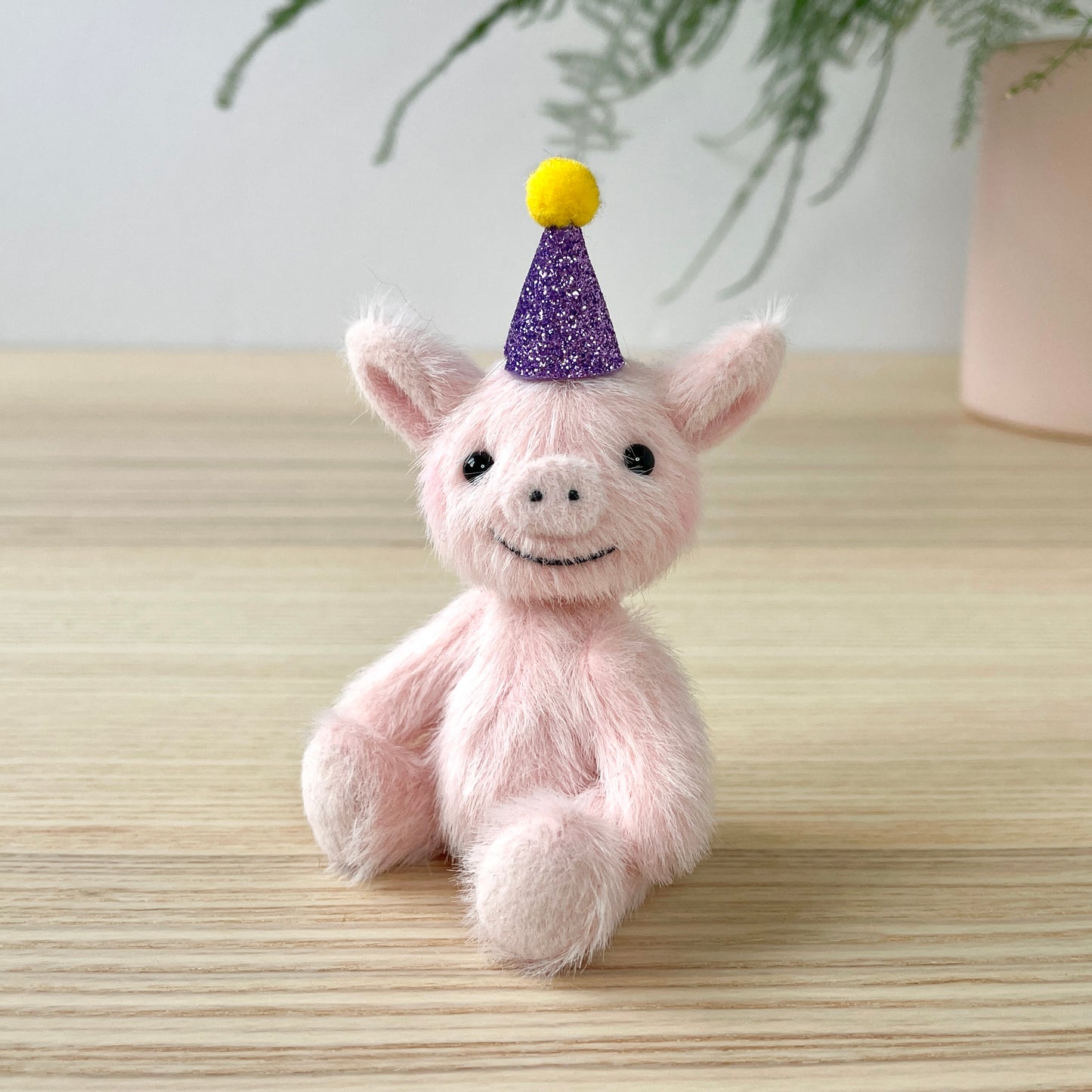 Party piglet with a purple party hat