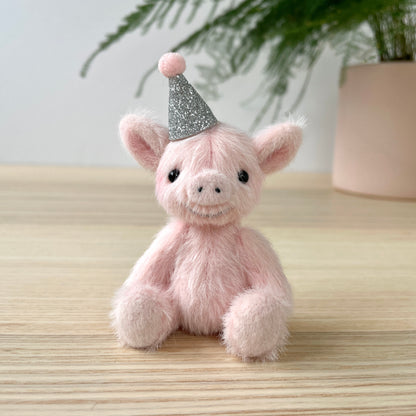 Party piglet with a silver party hat