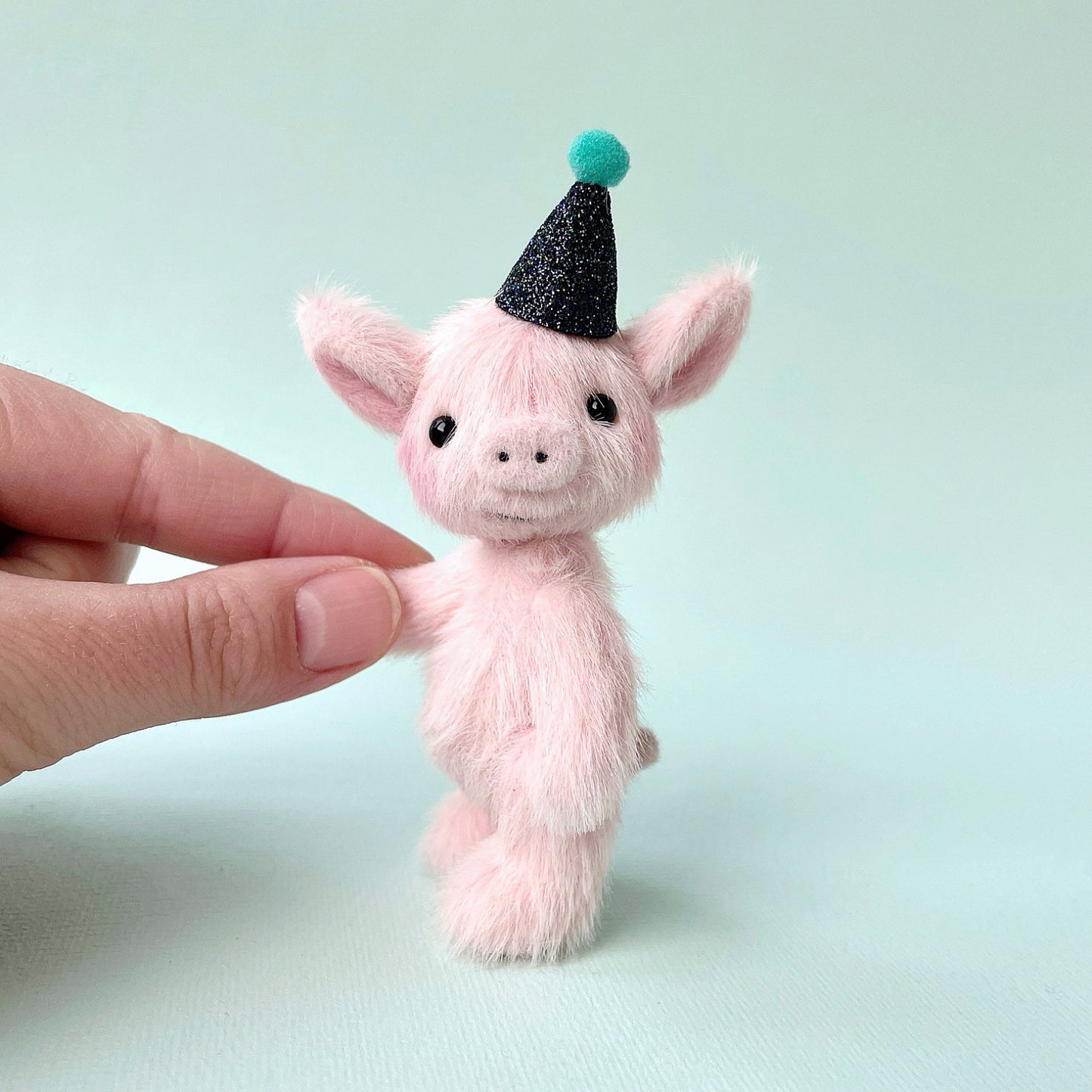 Party piglet with a black party hat